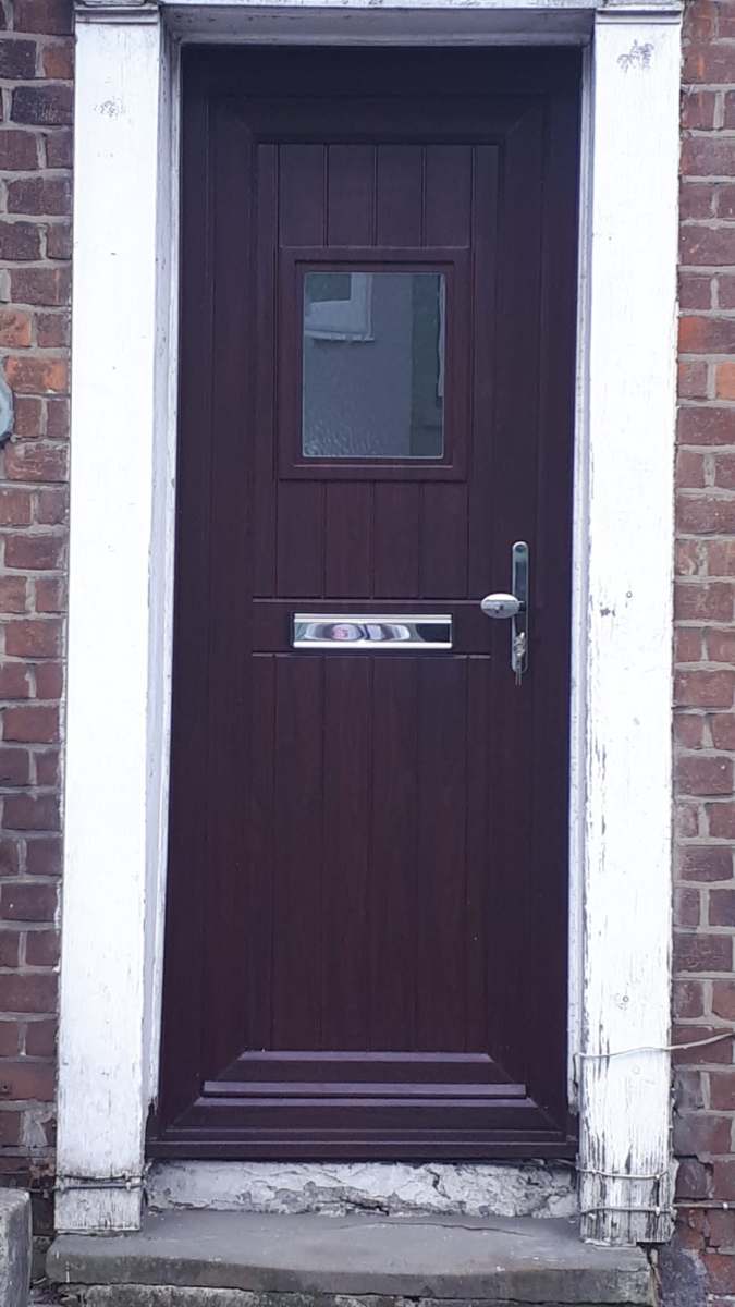 Dark composite front door fitted in Tendring, Essex by A&E Window Doctor