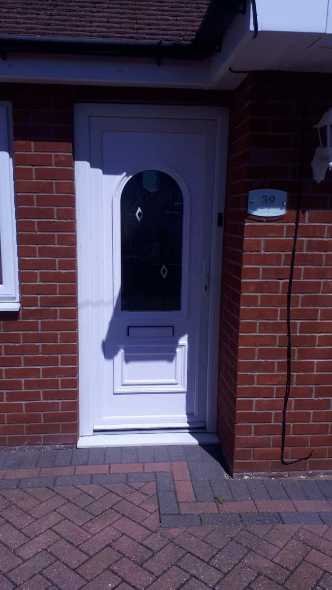 White uPVC door fitted brick home in Clacton-on-Sea, Essex by A&E Window Doctor