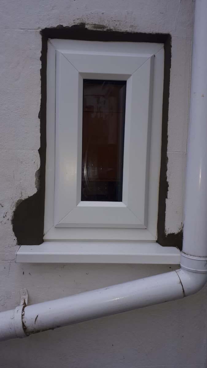 White uPVC door with side glass in Great Holland, Essex by A&E Window Doctor