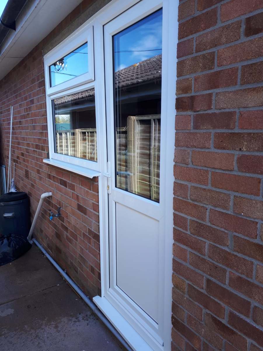 White uPVC side door and window in Thorpe-le-Soken, Essex by A&E Window Doctor